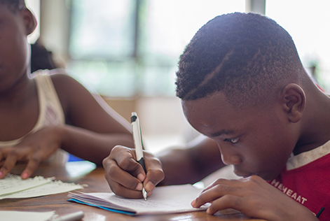 Kids lacing donated boots
